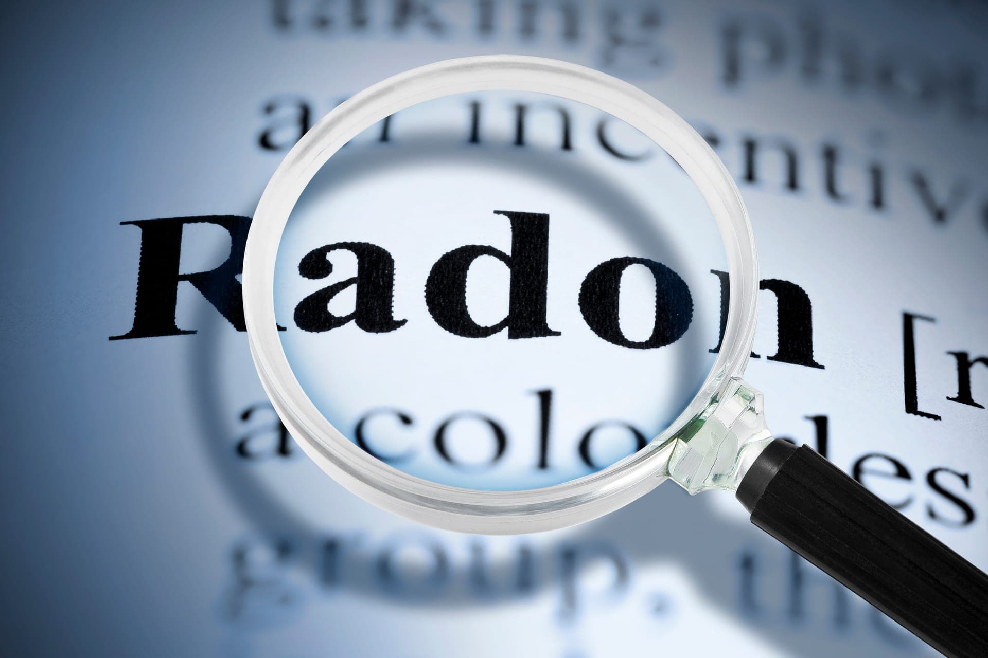 Home radon test kit and continuous monitor on a residential countertop